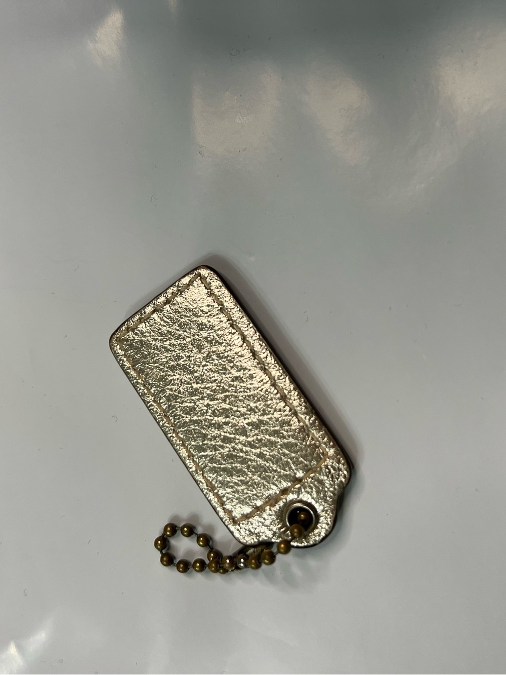 Coach Metallic Gold Leather Phone Keychain Charm